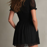 Sigrun — Black Smocked Mini Dress with Sheer Sleeves and Lace-Trim Hem
