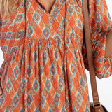Herta — Orange Ikat-Print Tiered Maxi Dress with Tie Neck and Balloon Sleeves