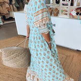 Wilmette — Printed V-Neck Maxi Dress with Tassel Tie and Fringe Hem