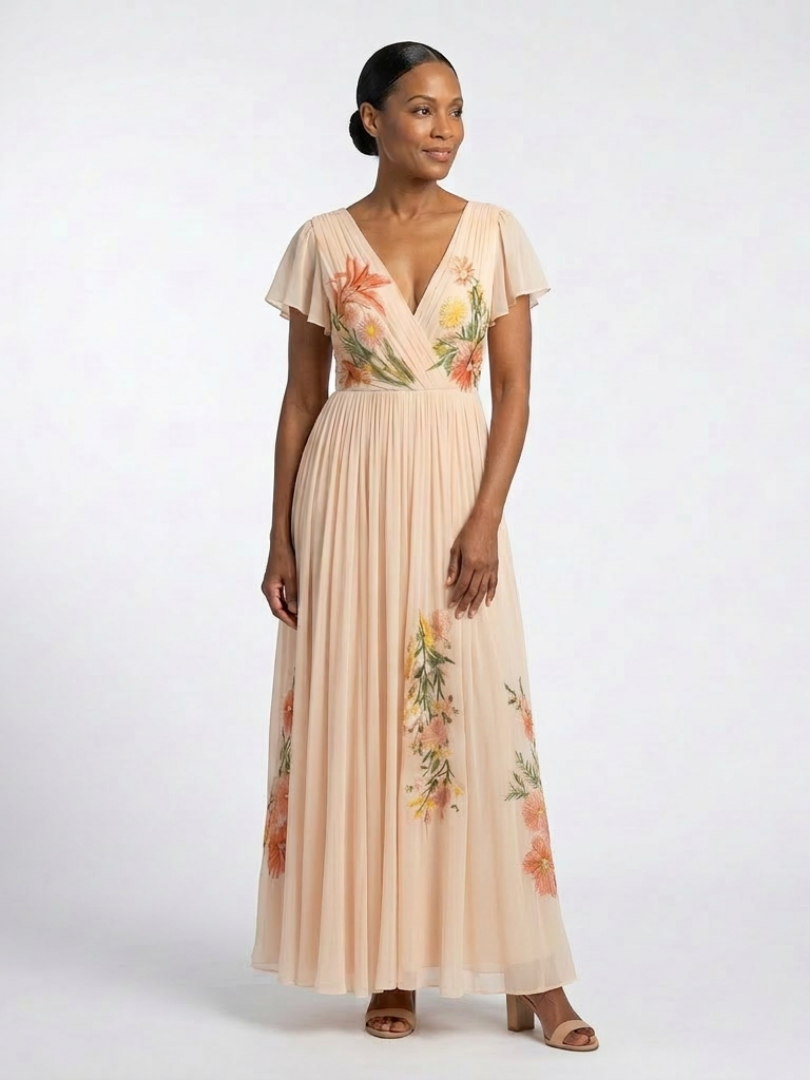 Melusine — Peach Pleated Maxi Dress with Floral Detail and Flutter Sleeves