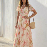 Alruna — Peach Floral V-Neck Maxi Dress with Flutter Sleeves and Gathered Waist