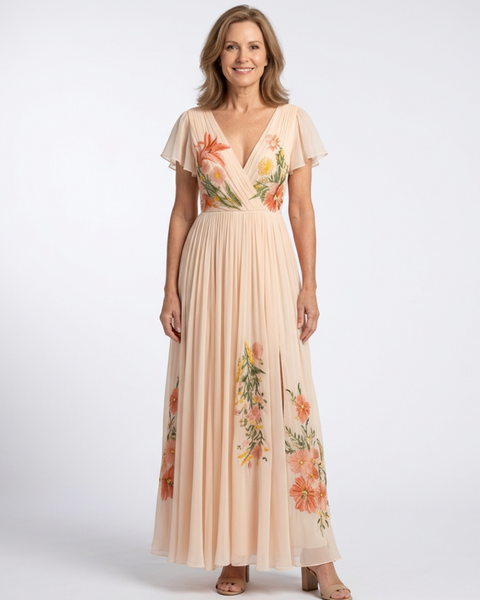 Melusine — Peach Pleated Maxi Dress with Floral Detail and Flutter Sleeves