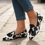 Isotta — Cow-Print Pointed Moccasins with Black Tassels