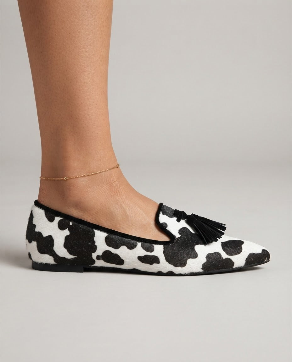 Isotta — Cow-Print Pointed Moccasins with Black Tassels