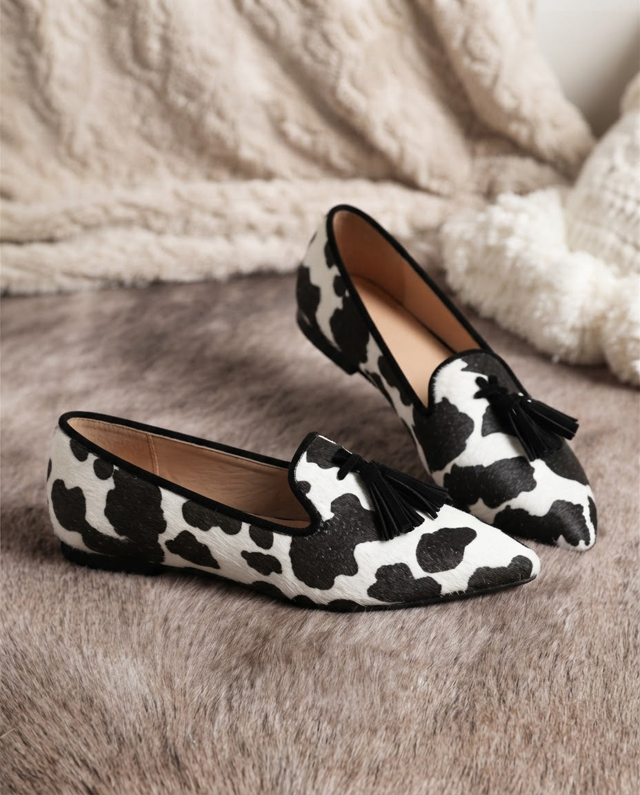 Isotta — Cow-Print Pointed Moccasins with Black Tassels