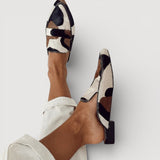 Erica — Cow-Print Pointed Moccasins